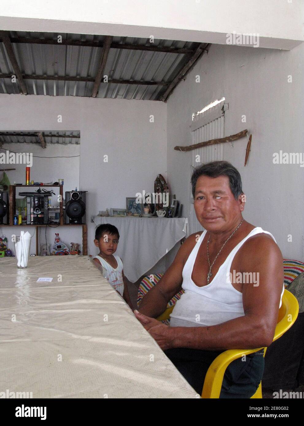 Misterveel Rodriguez poses at his home with his grandson in Nuevo Campechito after an interview with Reuters June 9, 2010. Within a week of the explosion of Mexico's Ixtoc offshore oil well in June 1979, Misterveel Rodriguez and other village fishermen were pulling up nets choked with tarballs instead of red snapper. Until the Deepwater Horizon rig drilling BP Plc's Macondo well off Louisiana blew up in April, Ixtoc was the only catastrophic oil spill at sea that was not caused by a tanker accident or sabotage. Picture taken June 9, 2010. To match Special Report: OIL-SPILL/IXTOC REUTERS/Robe Stock Photo
