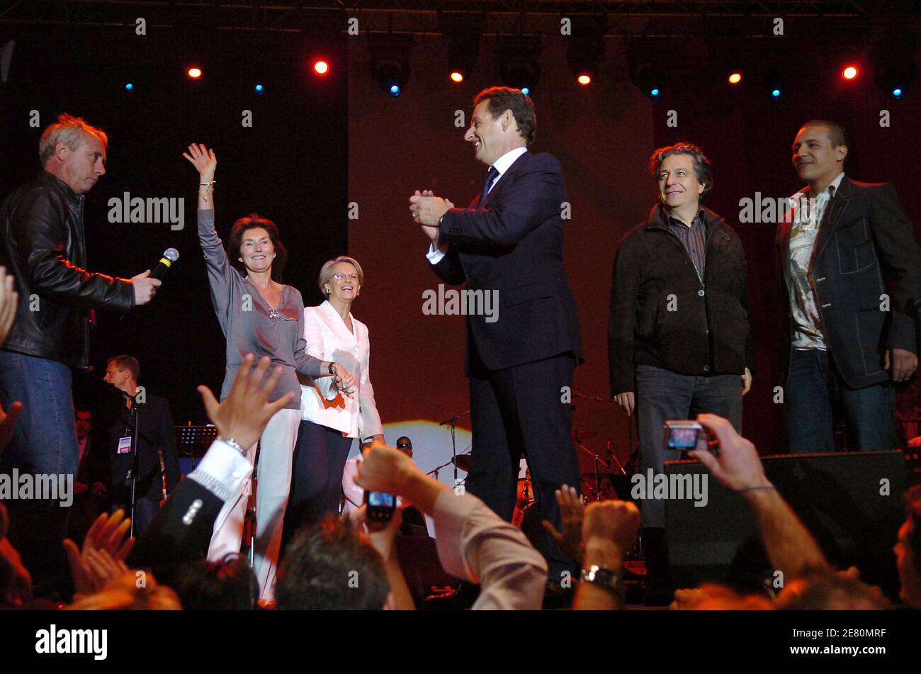 France's newly-elected president Nicolas Sarkozy addresses his supporters alongside his wife Cecilia, Defense Minister Michele Alliot-Marie, actor Christian Clavier and singer Faudel, Place de la Concorde in Paris, France, May 6, 2007. French voters elected reform-minded Nicolas Sarkozy as their new president on Sunday, giving him a comfortable winning margin, preliminary official results and projections from four polling agencies showed. With more than half of the vote counted, Sarkozy was scoring just over 53 percent to a little more than 46 percent for Socialist Segolene Royal. Polling agen Stock Photo
