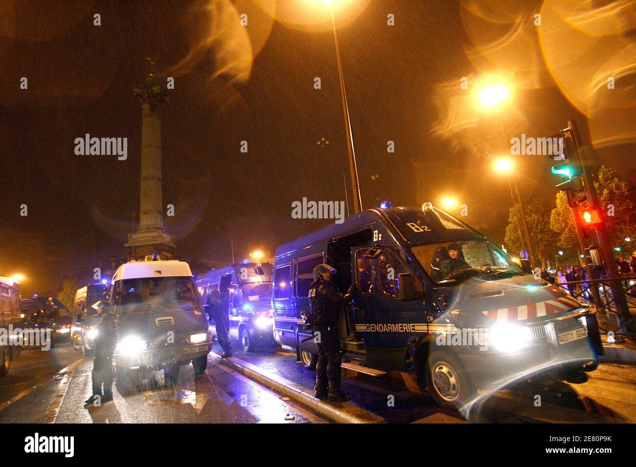 French mobile gendarmes surround demonstrators as they take them to police  vans following a protest over right-wing (UMP) candidate Nicolas Sarkozy's  triumph in presidential elections, on May 07, 2007 on the Place