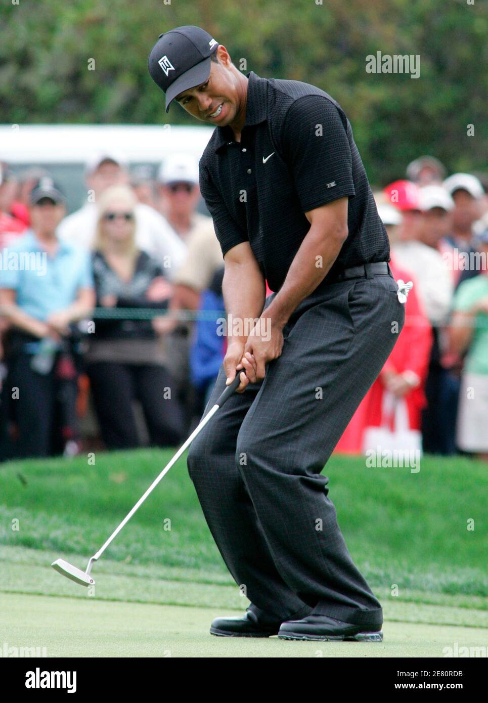 Tiger Woods reacts to a missed putt on the first hole during the second round of play at the Arnold Palmer Invitational golf tournament held at the Bay Hill Club in Orlando, Florida, March 16, 2007. REUTERS/Rick Fowler (UNITED STATES) Stock Photo