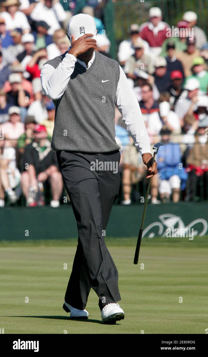 Tiger Woods reacts to a missed putt on the 17th hole during the third round of play at the Arnold Palmer Invitational golf tournament at the Bay Hill Club in Orlando, Florida March 17, 2007. REUTERS/Rick Fowler (UNITED STATES) Stock Photo