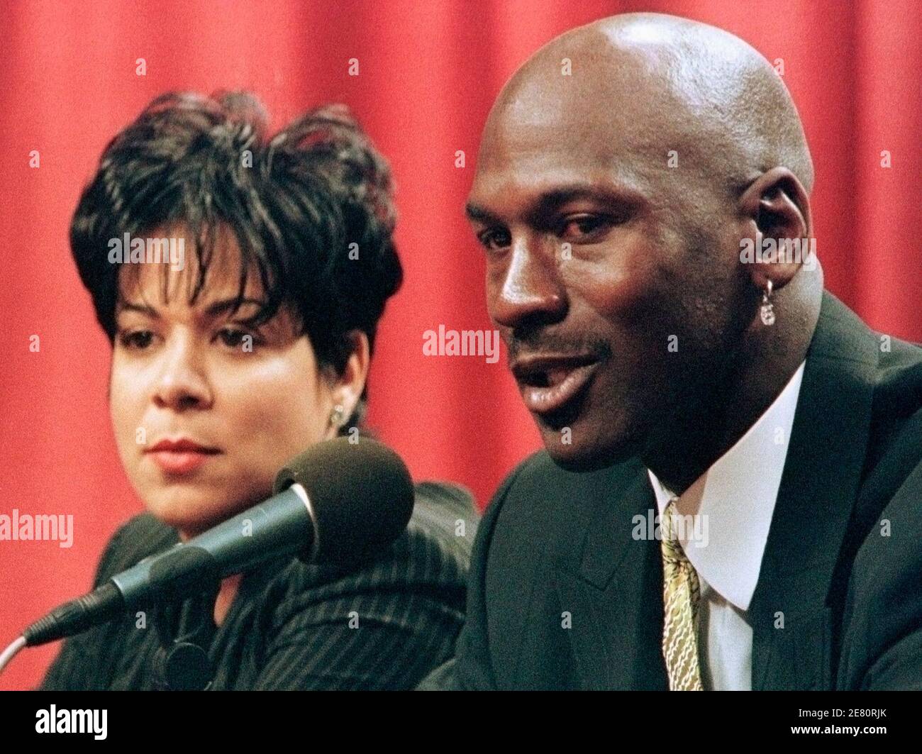 Former basketball superstar Michael Jordan and his wife Juanita Vanoy are  shown in this January 13, 1999 file photograph as Jordan announced that he  was retiring from the game of basketball in