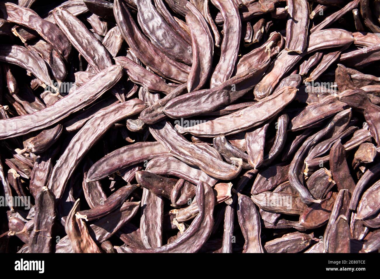 many carob dried Brown for sale to the fruit market Stock Photo