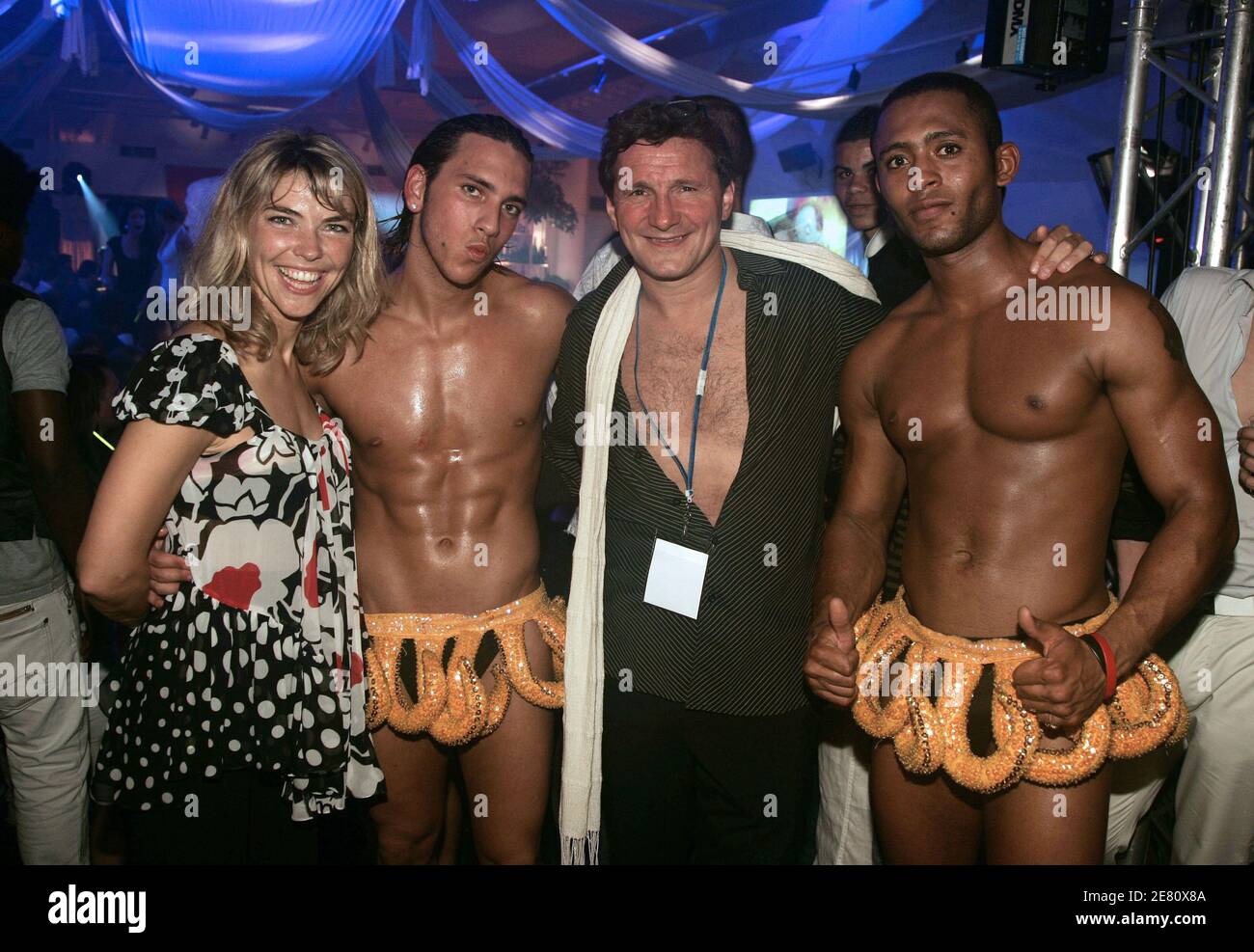 Nathalie Vincent and Patrick Adler pose with gogo dancers during the 'Banana Cafe' party at the 14th Festival of Young Fashion Designers in Dinard, France on May 12, 2007. Photo by Edouard Bernaux/ABACAPRESS.COM Stock Photo