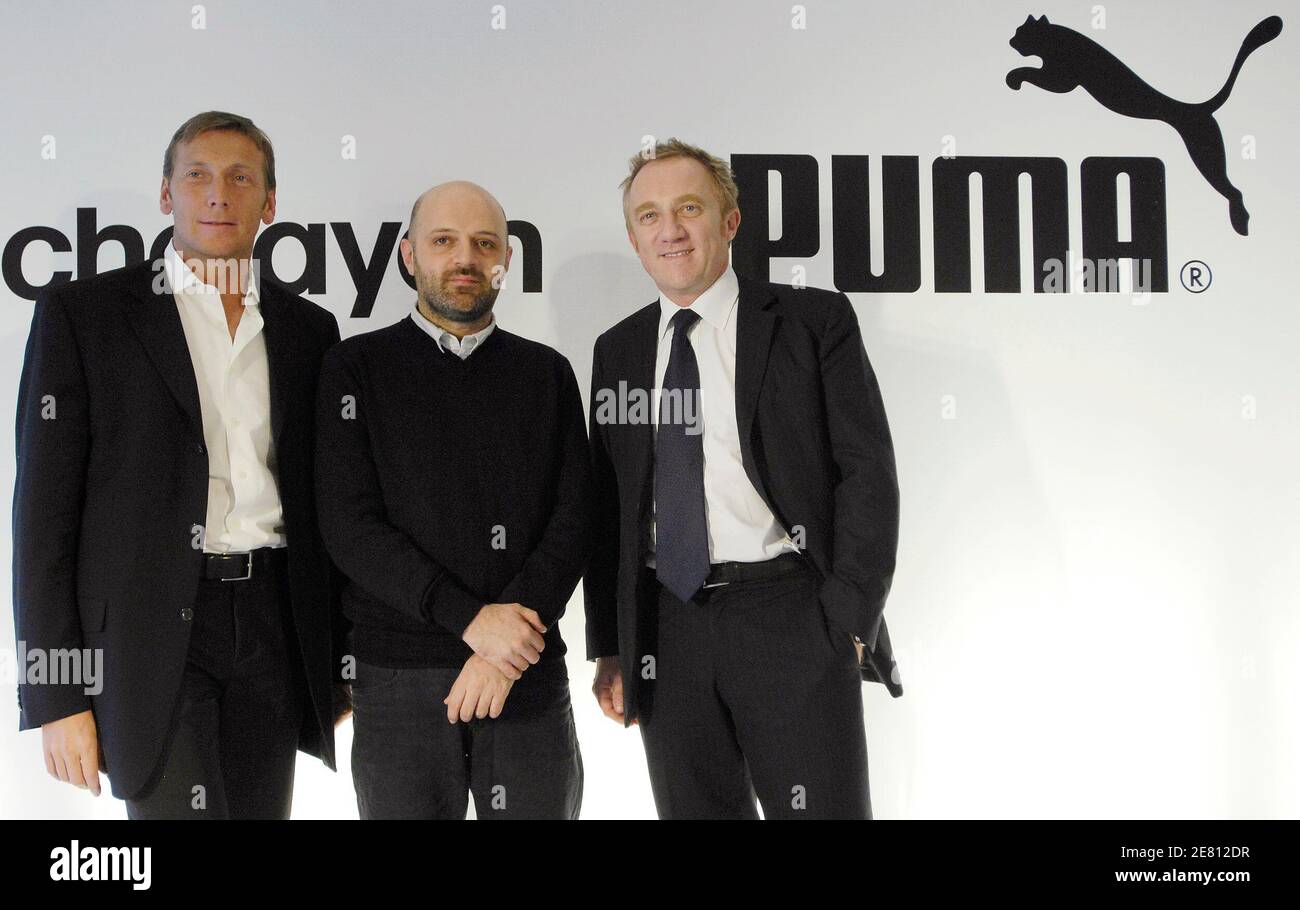 Puma CEO Jochen Zeitz (L), fashion designer Hussein Chalayan (C) and  Pinault-Printemps-Redoute (PPR) Chairman and CEO Francois-Henri Pinault  pose for the media during a press conference in Paris February 28, 2008.  Sports