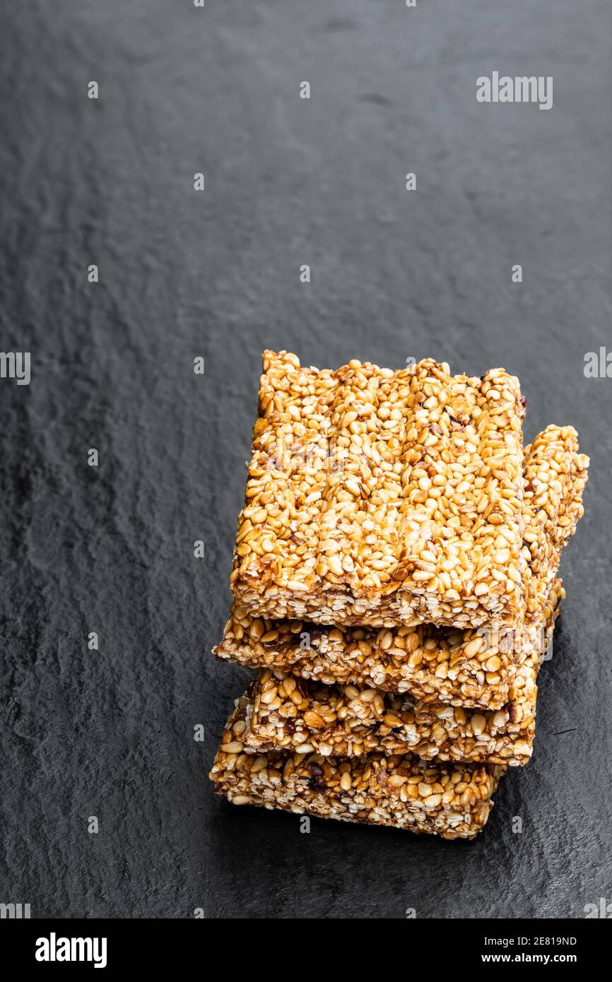 Sesame seed honey bars on black stone background Stock Photo Alamy