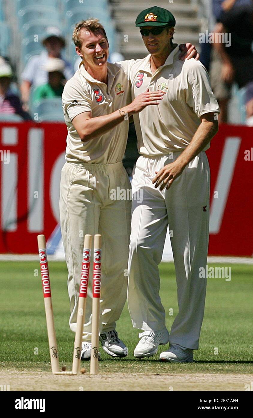 Australia's Brett Lee (L) is congratulated by fellow paceman Glenn McGrath  after taking the wicket of South Africa's Jacques Kallis bowled for 23 runs  during the first innings of the second test