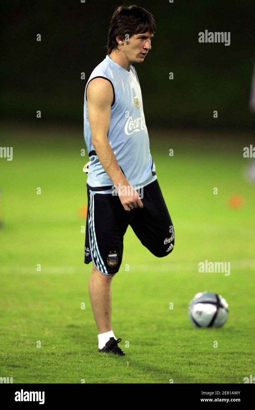 Argentina S Lionel Messi Stretches During A Training Session In Doha November 14 2005