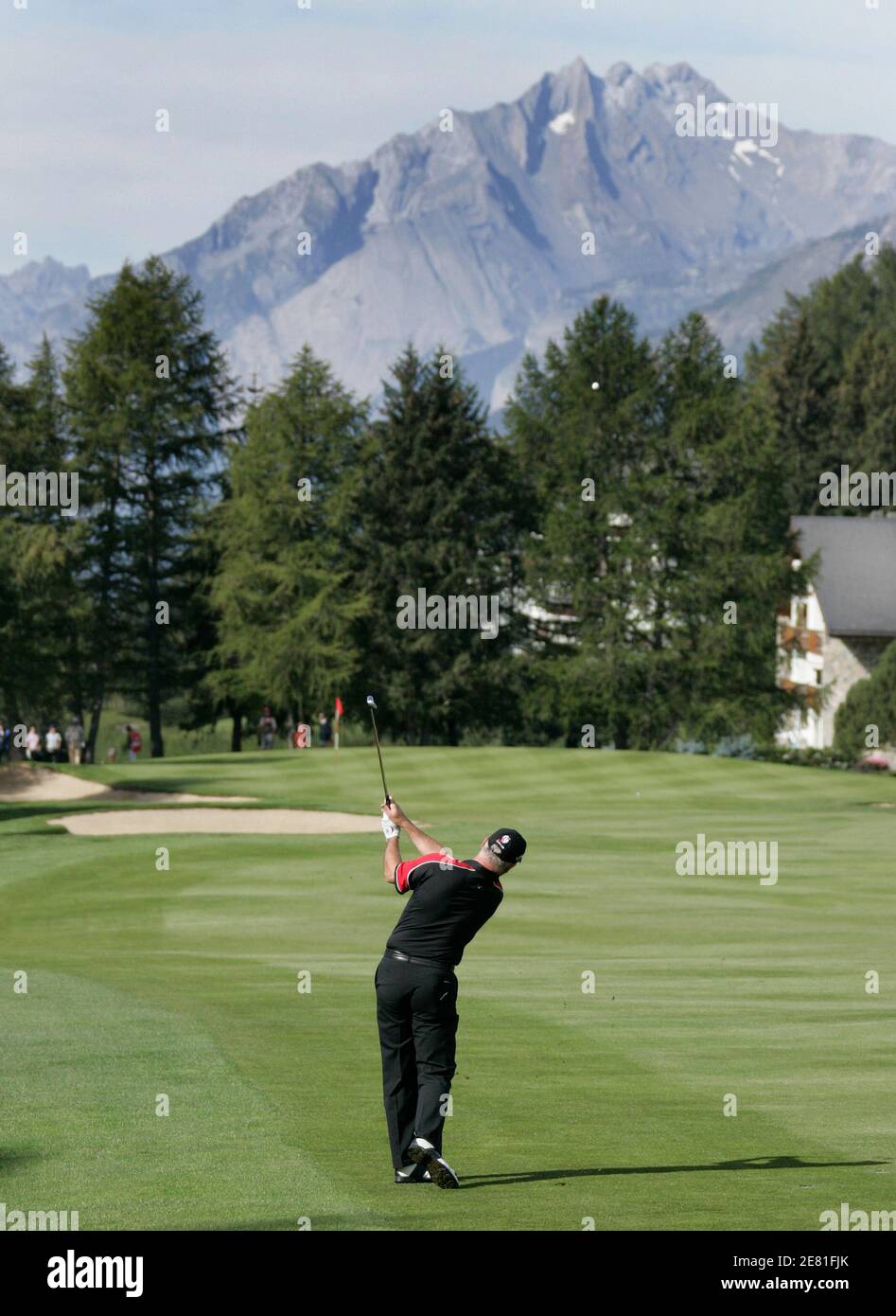 Britain's Philip Archer hits an approach shot onto the 1st green during the  second round of the European Masters golf tournament in Crans-Montana  September 7, 2007. REUTERS/Denis Balibouse (SWITZERLAND Stock Photo -