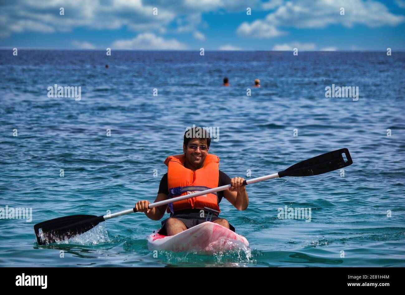 Kreta or Crete, Greece - A man in life jacket floating and paddling on a  kayak in a sea against clouds. Water sport kayaking during summer Stock  Photo - Alamy