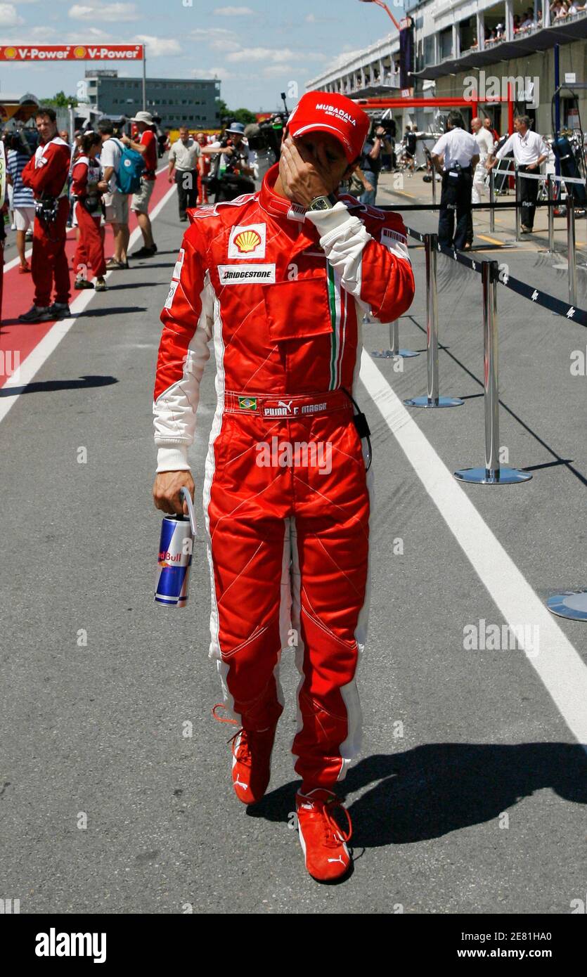 Ferrari Formula One driver Felipe Massa of Brazil wipes his face after the  qualifying round at the Canadian F1 Grand Prix in Montreal, June 9, 2007.  Massa qualified in fifth place for