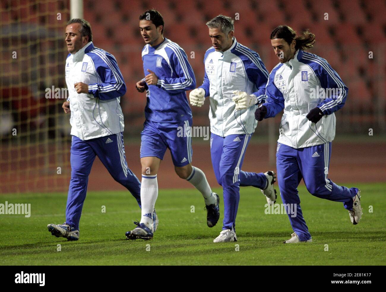 L-R) Topalidis Nikos, assistant coach Loukas Vyntra, Antonis Nikopolidis  and Ioannis Amanatidis run during the training session a day before their  Euro 2008 Group C qualifying soccer match against Hungary in Budapest,