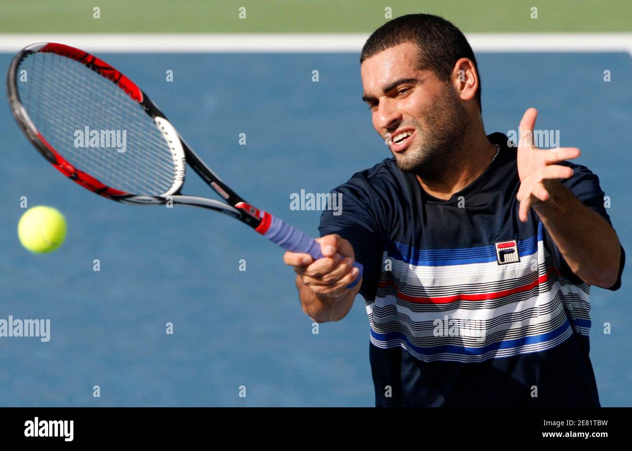 Andy Ram of Israel returns the ball during his doubles match with Kevin  Ullyett of Zimbabwe against David Ferrer of Spain and Marat Safin of Russia  on the third day of the