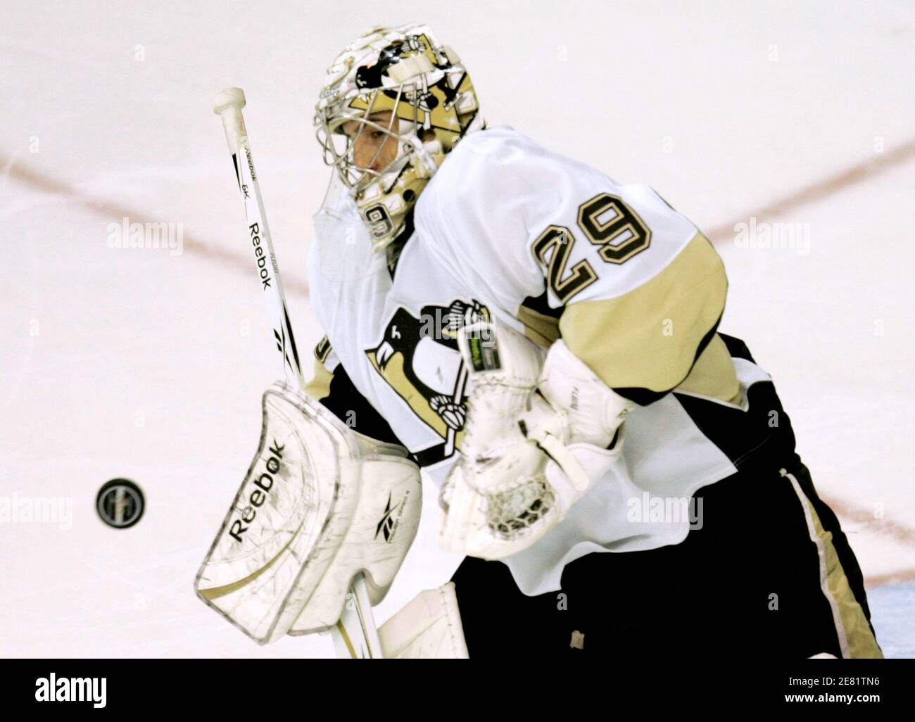 Pittsburgh Penguins goalie Marc-Andre Fleury eyes the puck in the second period of their NHL hockey game against the Washington Capitals in Washington March 8, 2009.    REUTERS/Gary Cameron    (UNITED STATES) Stock Photo