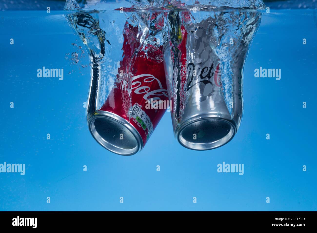 Freeze motion photo of mini cans of diet coke and coca cola dropped into water Stock Photo Alamy