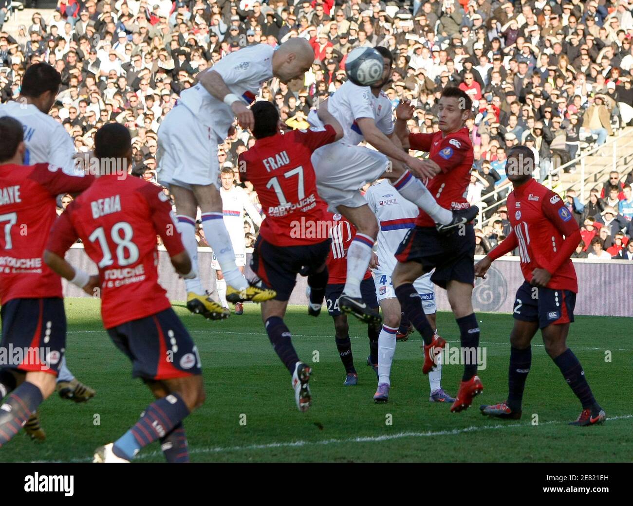 Olympique Lyon's Cris (wearing yellow boots) heads the ball to score  against Lille during their French Ligue 1 soccer match at the Gerland  stadium in Lyon, April 11, 2010. REUTERS/Robert Pratta (FRANCE -