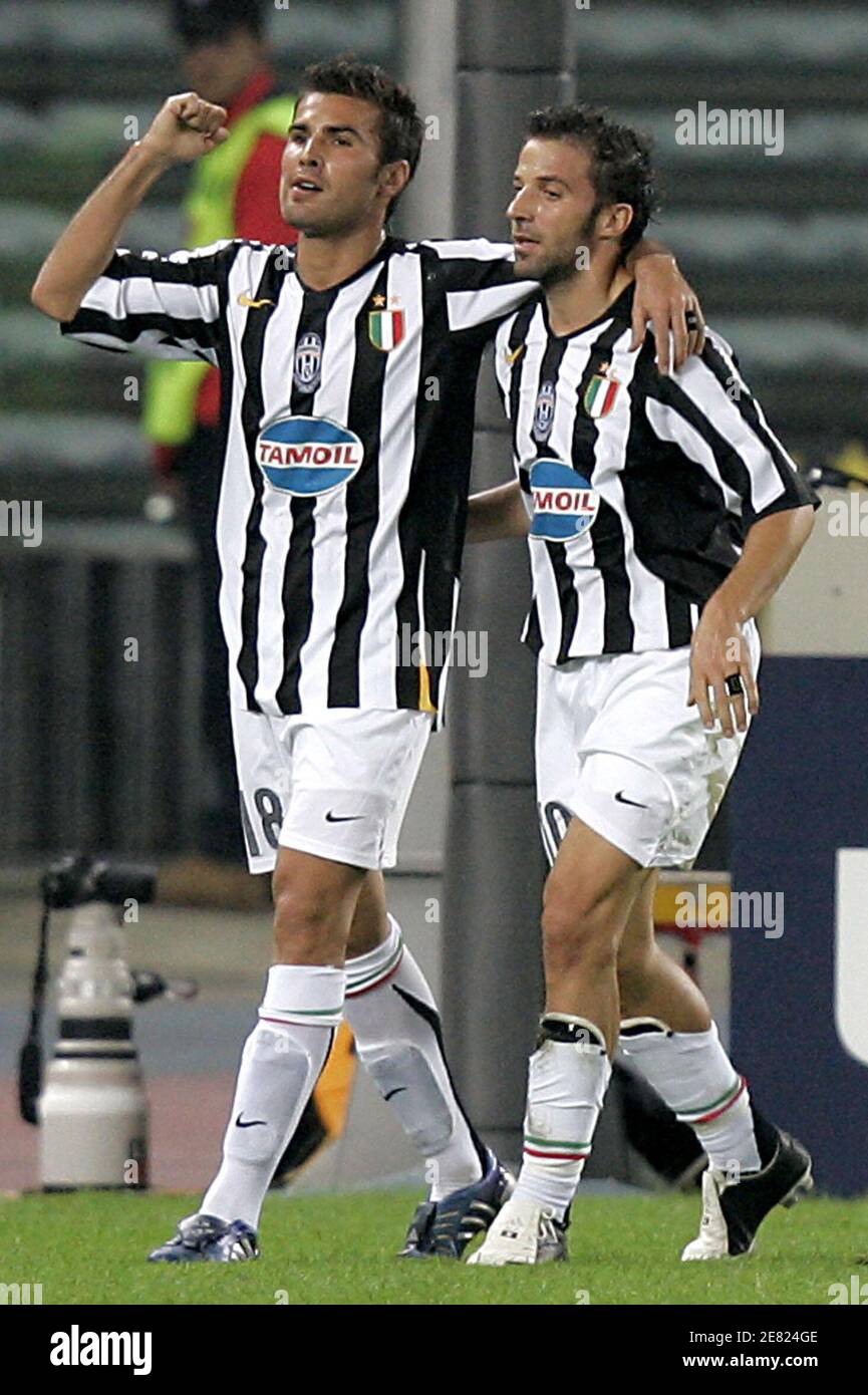 Juventus' Adrian Mutu (L) celebrates with team mate Alessandro del Piero  after scoring a goal against Rapid Vienna during their Champions League  Group A soccer match at the Delle Alpi stadium in