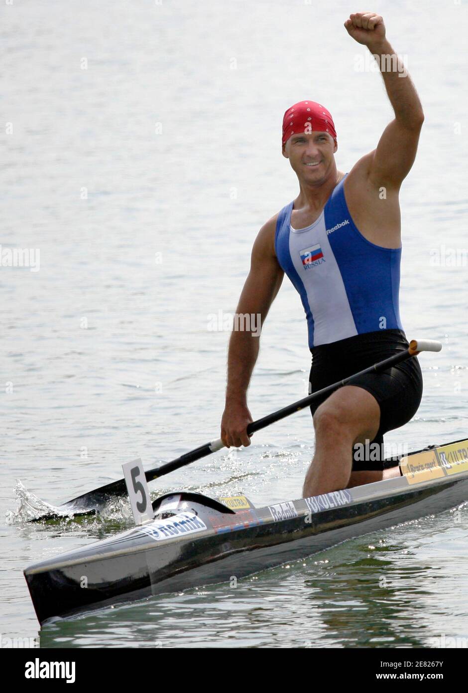 Maxim Opalev of Russia celebrates his victory in the C1 Men 500m race at the European Flatwater Championships in the central Bohemian village of Racice, Czech Republic, July 9, 2006.   REUTERS/Petr Josek   (Czech Republic) Stock Photo