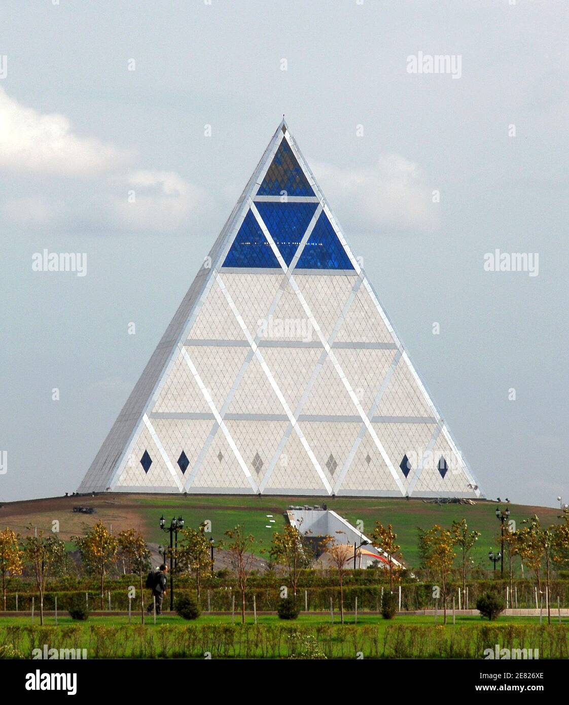 A general view shows the Pyramid of Peace and Accord in Astana September 12, 2006.  The 62-metre high pyramid designed by British architect Lord Norman Foster was commissioned by President Nursultan Nazarbayev to host a congress of world religious leaders, an event he dreamt up in order to put Kazakhstan on the map as a serious player in global affairs. Picture taken September 12, 2006. To match feature KAZAKHSTAN PYRAMID  REUTERS/Michael Steen (KAZAKHSTAN) Stock Photo