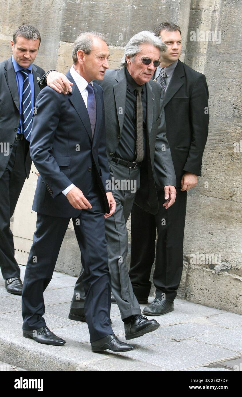 Alain Delon and Bertrand Delanoe arrive at the funeral mass for French  actor Jean-Claude Brialy