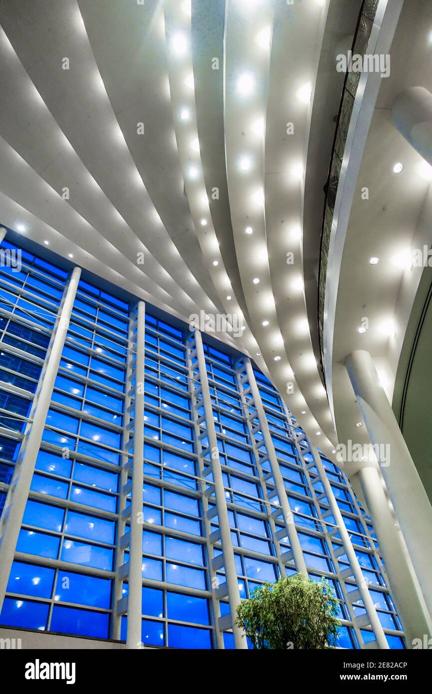 Blue hour through the multistory windows in the lobby of the Sanford and Dolores Ziff Ballet Opera Houseof The Arsht Center for the Performing Arts of Stock Photo