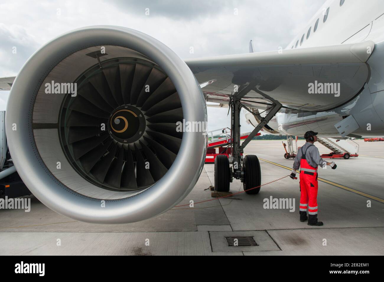 GERMANY, Hamburg airport , trial phase with biofuel , Lufthansa jet Airbus A321 , one turbine is powered with 50 percent biofuel a blend of Jatropha , Camelina oil and animal grease , aircraft engine , round circle eco kerosine Stock Photo