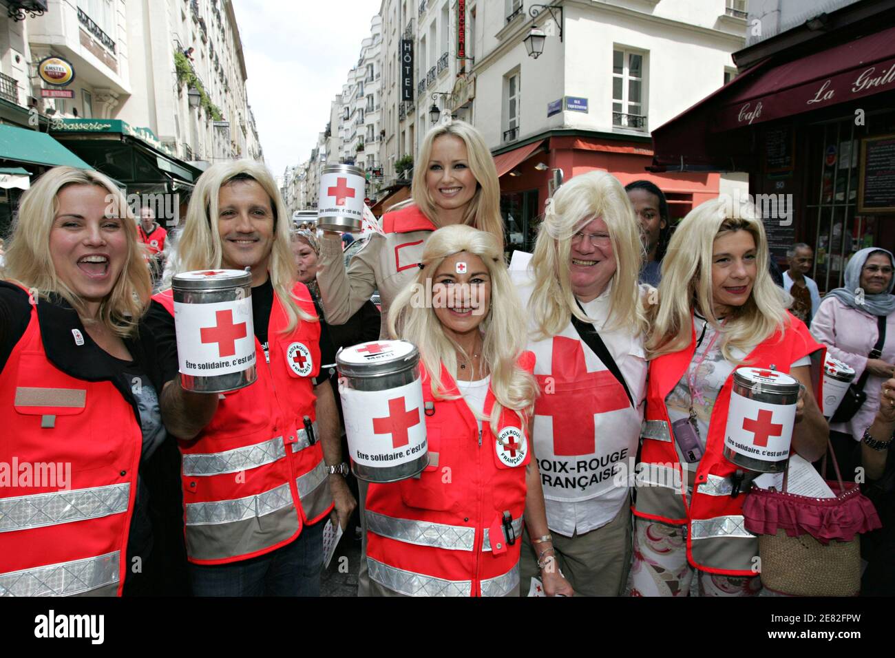 Sophie Favier, Babsie Steger and Frigide Barjot (l to r) wearing blond wigs, are among the celebs who came to help French Red Cross Godmother Adriana Karembeu (back) during a National collect in Paris, France on June 9, 2007. Photo by Mousse/ABACAPRESS.COM Stock Photo