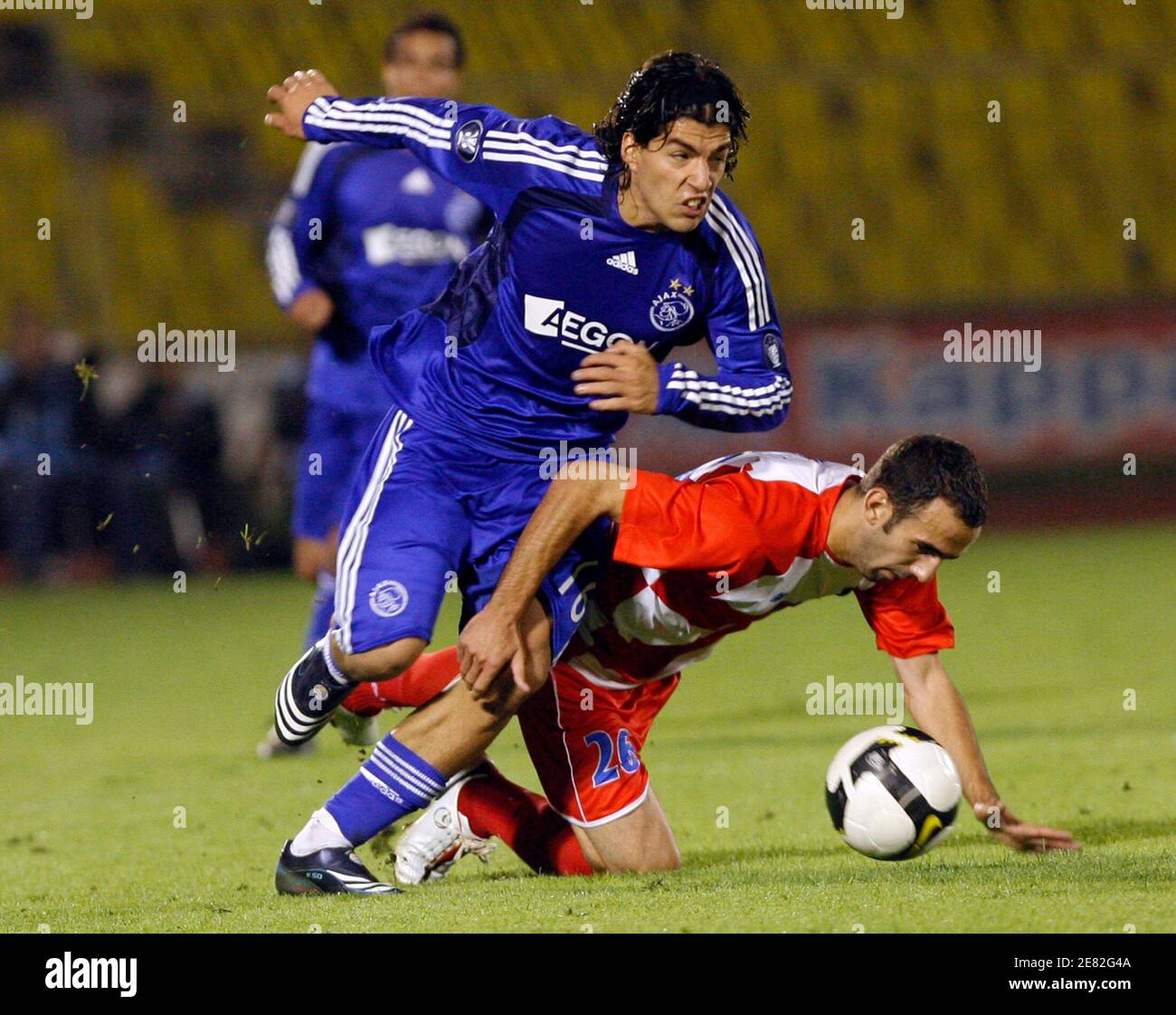 Ajax's Luis Suarez (L) struggles for the ball with Borac's Slavko Maric during their UEFA Cup soccer match in Belgrade September 18, 2008.  REUTERS/Ivan Milutinovic  (SERBIA) Stock Photo
