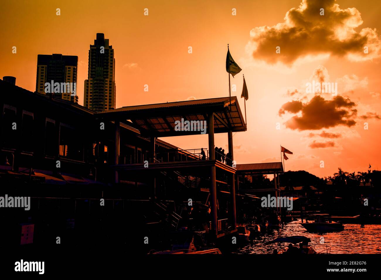Bayfront Marketplace silhouetted at sunset on Biscayne Bay in Miami, Florida. Stock Photo