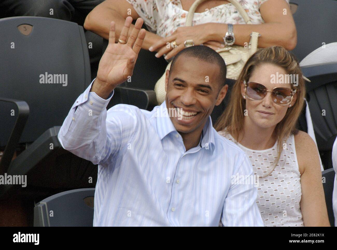 French soccer player Thierry Henry and his wife attend the men's