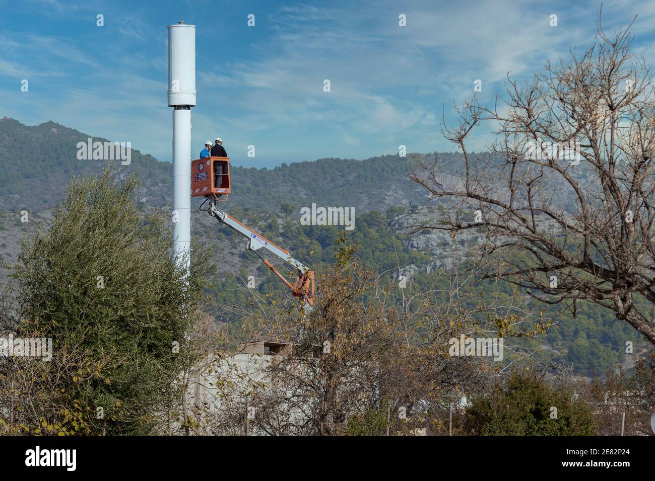 two operators on a crane scaffold in Benicasim, Castellón de la Plana, Valencian Community, Spain, Europe Stock Photo