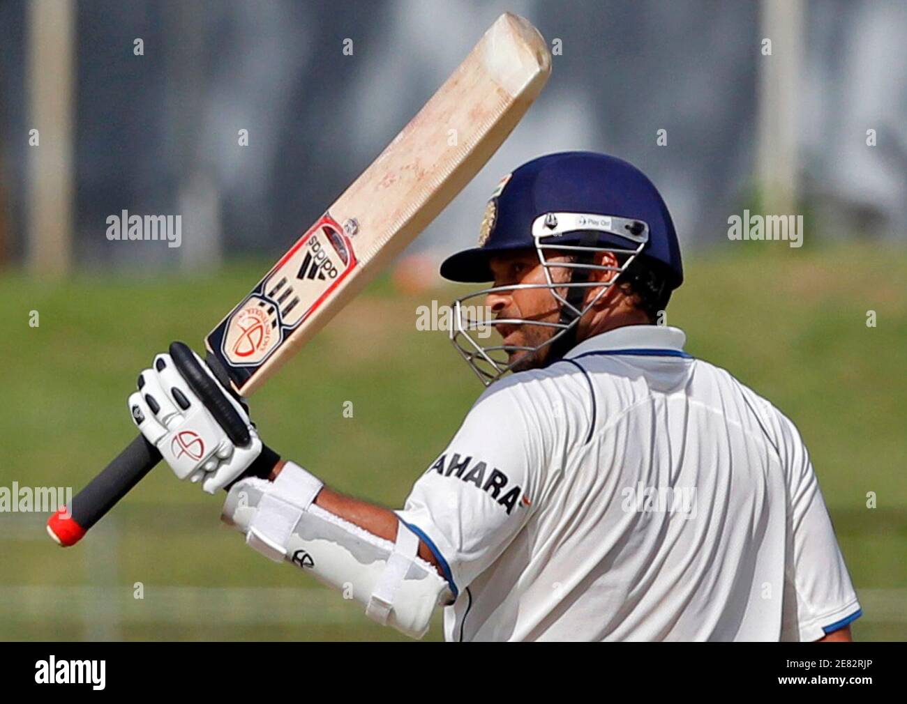 India's Sachin Tendulkar raises his bat to celebrate scoring his half  century against Sri Lanka during the third day of their second test cricket  match in Colombo July 28, 2010. REUTERS/Andrew Caballero-Reynolds (