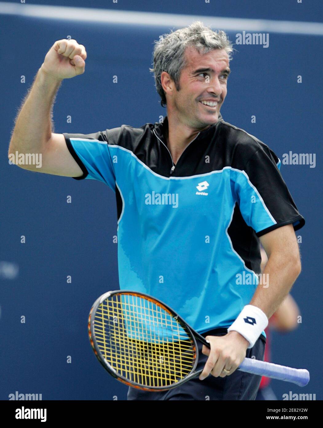 Davide Sanguinetti of Italy celebrates his win over David Nalbandian of  Argentina at the end of their match at the Toronto Masters tennis  tournament in Toronto August 7, 2006. REUTERS/Peter Jones (CANADA