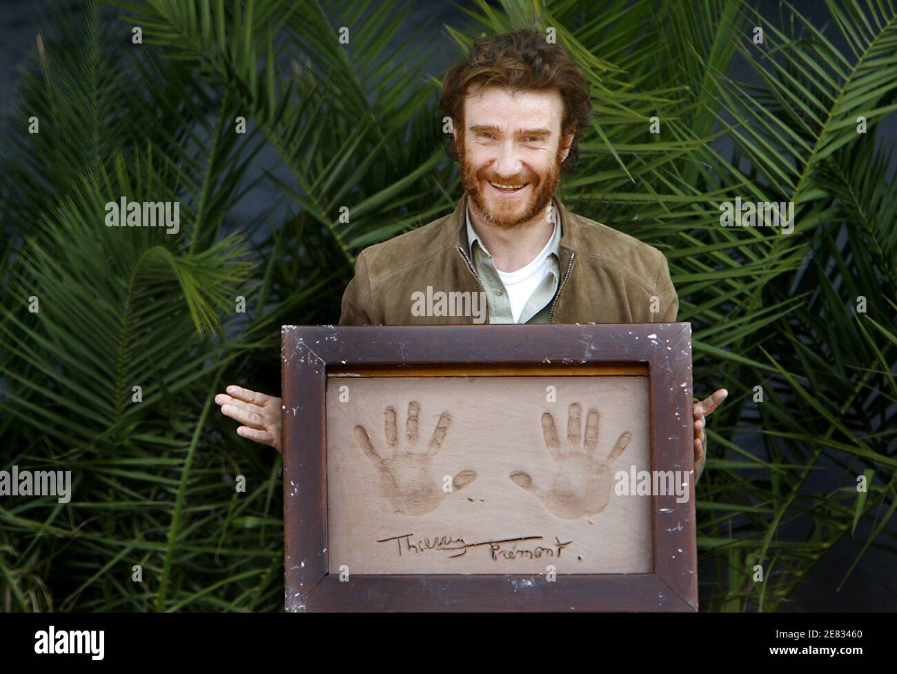 French actor Thierry Fremont poses with his handprints in the clay during the '25th Festival du Film Policier' (Mystery Film) in Cognac, France, on June 24, 2007. Photo by Patrick Bernard/ABACAPRESS.COM Stock Photo