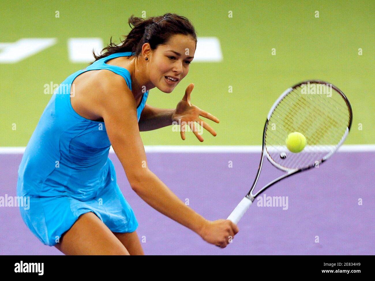Ana Ivanovic of Serbia returns a backhand to Justine Henin of Belgium  during her semi-final match at the WTA Championships tennis tournament in  Madrid November 10, 2007. REUTERS/Sergio Perez (SPAIN Stock Photo -
