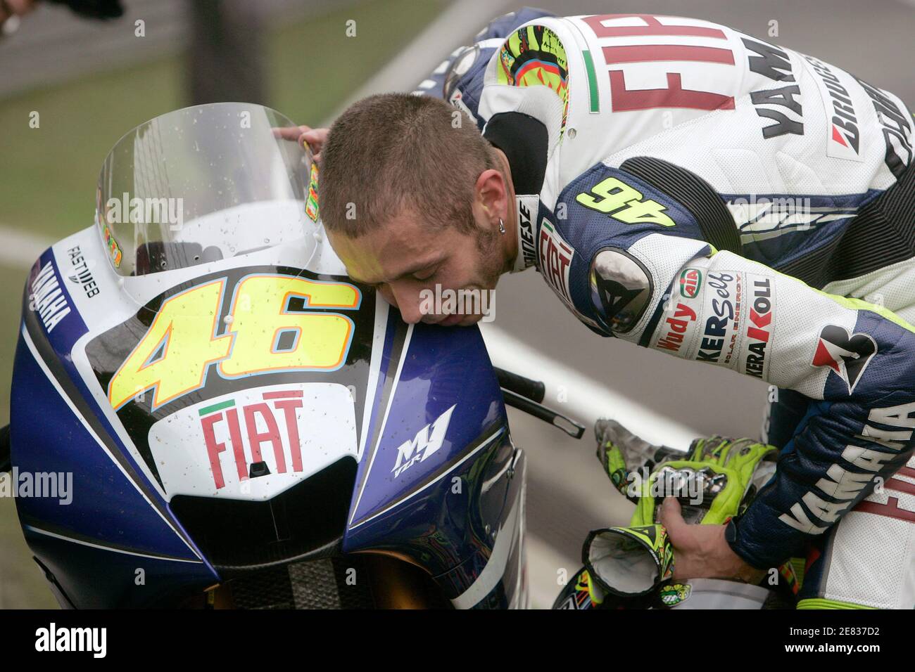 Yamaha MotoGP rider Valentino Rossi of Italy kisses his bike after winning  the Chinese Grand Prix at the Shanghai International Circuit May 4, 2008.  REUTERS/Aly Song (CHINA Stock Photo - Alamy