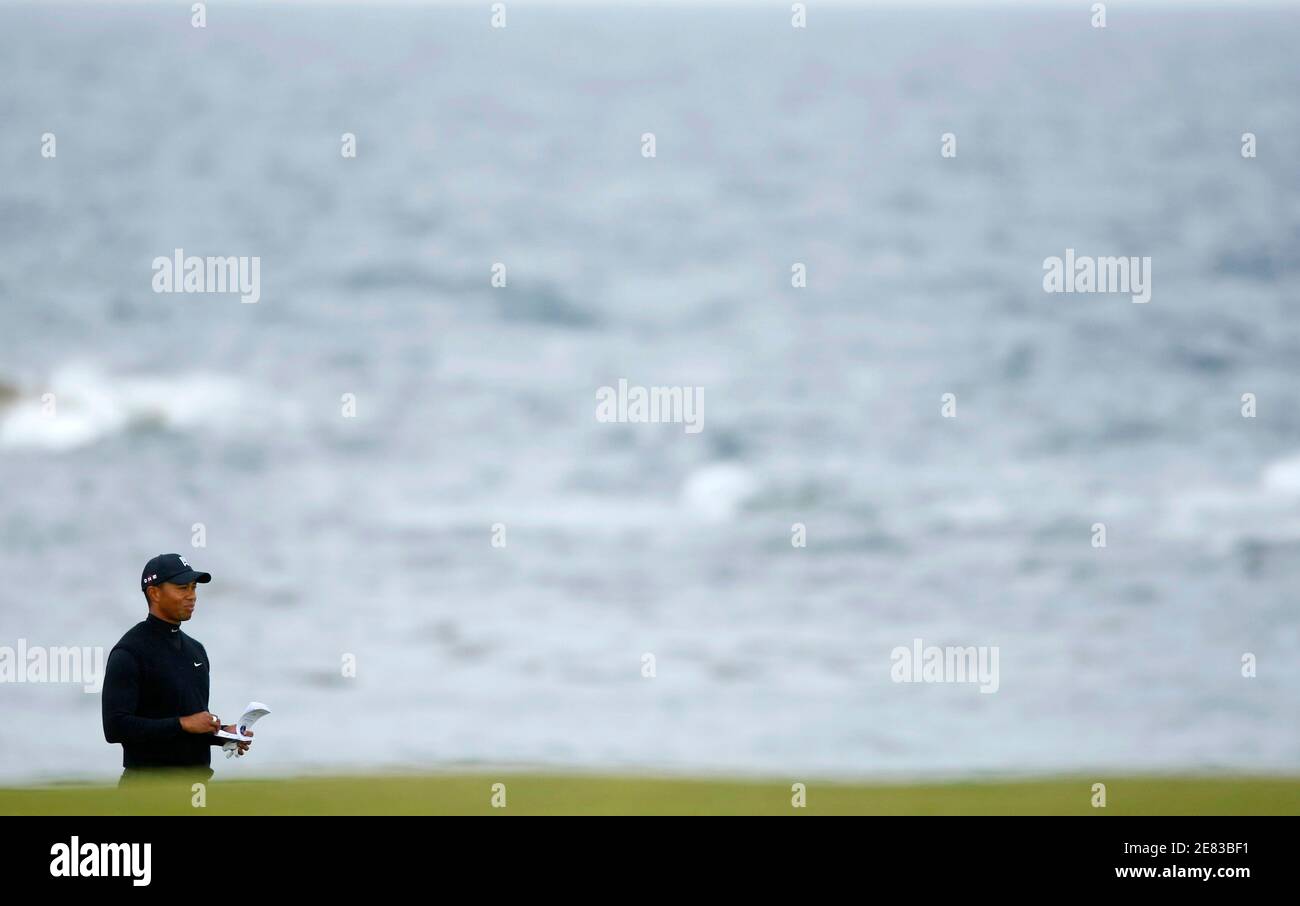 Tiger Woods of the U.S. checks his notes on the tenth fairway before playing his provisional ball during the second round of the British Open championship at the Turnberry Golf Club in Scotland July 17, 2009.     REUTERS/Mike Blake (BRITAIN SPORT GOLF) Stock Photo