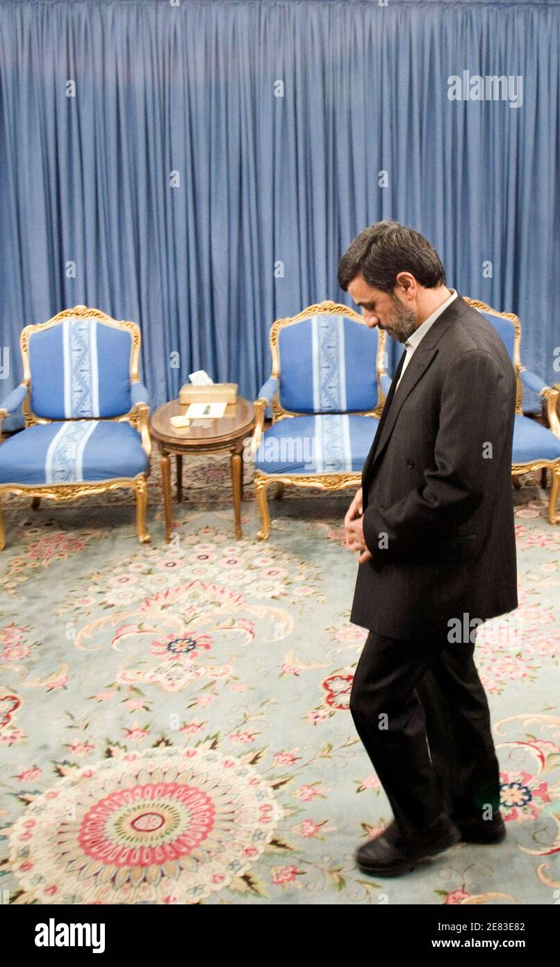 EDITORS' NOTE: Reuters and other foreign media are subject to Iranian restrictions on leaving the office to report, film or take pictures in Tehran.  Iran's President Mahmoud Ahmadinejad walks before starting an official meeting in Tehran March 8, 2010. REUTERS/Raheb Homavandi (IRAN - Tags: POLITICS) Stock Photo