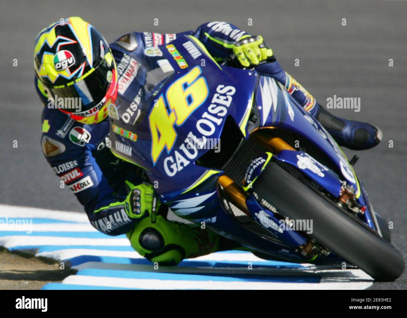 Italian MotoGP rider Valentino Rossi of Yamaha speeds out of a corner  during an afternoon free practice session of Japan Grand Prix of the 2005  MotoGP World Championships at Twin Ring Motegi,