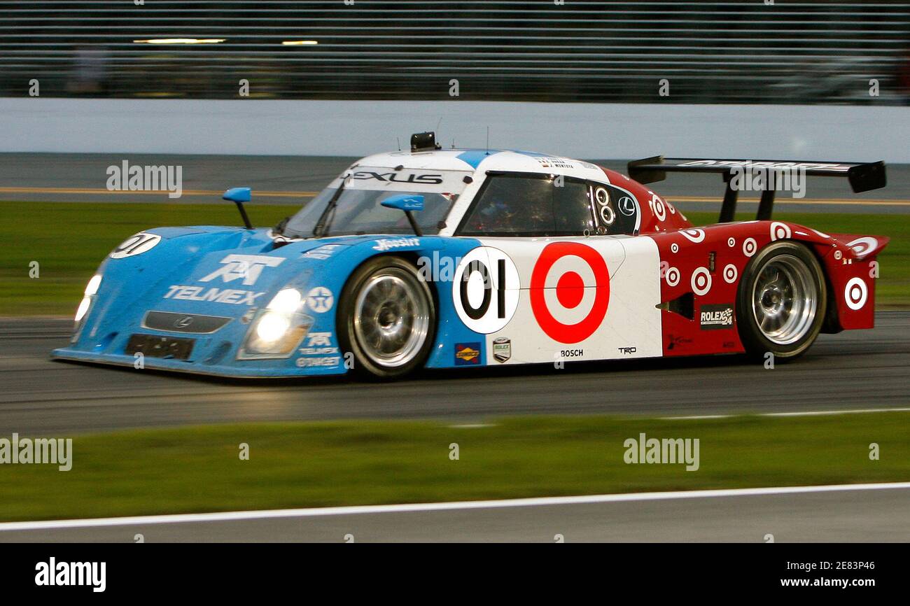 The leader of the Rolex 24 At Daytona Juan Pablo Montoya of Colombia  navigates the infield in the (01) Lexus Riley as the sun sets at Daytona  International Speedway in Daytona, Florida