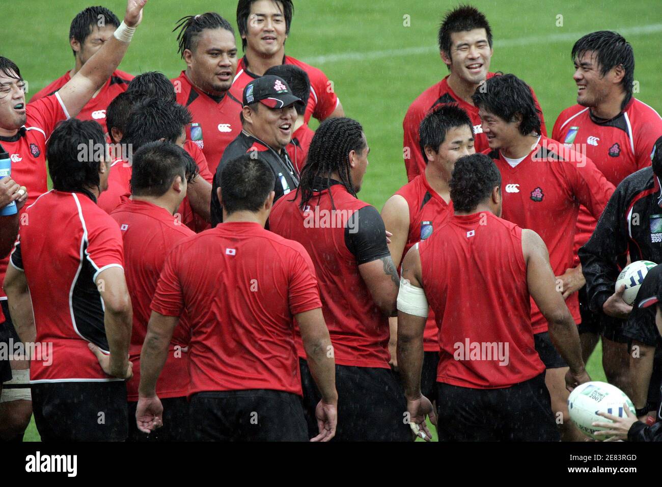 Japan rugby team players have a break during training session under the rain at stadium Michel Bendichou in Colomiers, southwestern France, September 14, 2007. Japan plays in Pool B with Australia, Wales, Fiji and Canada in the Rugby World Cup 2007 REUTERS/Jean-Philippe Arles (FRANCE) Stock Photo