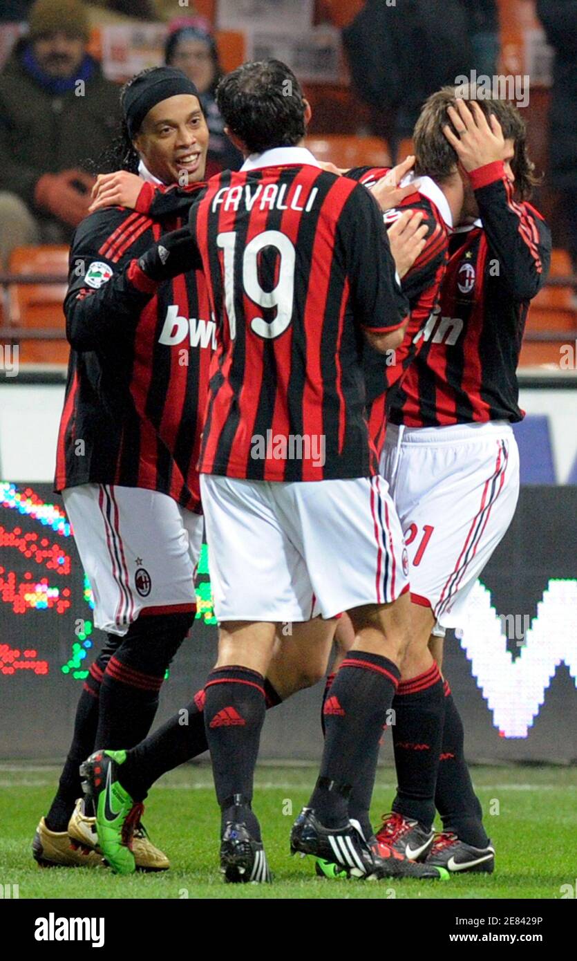 AC Milan's Klass-Jan Huntelaar (3rd L) celebrates with teammates Ronaldinho  (L), Giuseppe Favalli (2nd L) and Andrea Pirlo after scoring against  Udinese during their Italian Serie A soccer match at the San