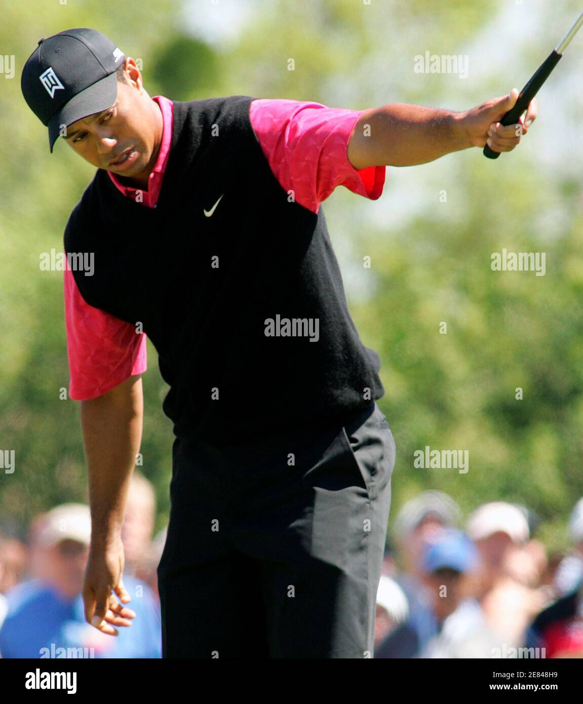 Tiger Woods reacts after making a putt for birdie on the first green during the fourth round of play at the Arnold Palmer Invitational golf tournament held at the Bay Hill Club in Orlando, Florida, March 18, 2007. REUTERS/Rick Fowler (UNITED STATES) Stock Photo