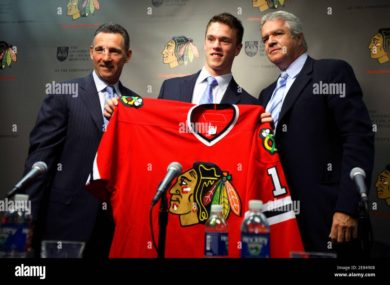 Chicago Blackhawks General Manager Dale Tallon (R) and Head Coach Denis  Savard (L) introduce newly signed forward Jonathan Toews during a news  conference in Chicago May 29, 2007. REUTERS/John Gress (UNITED STATES