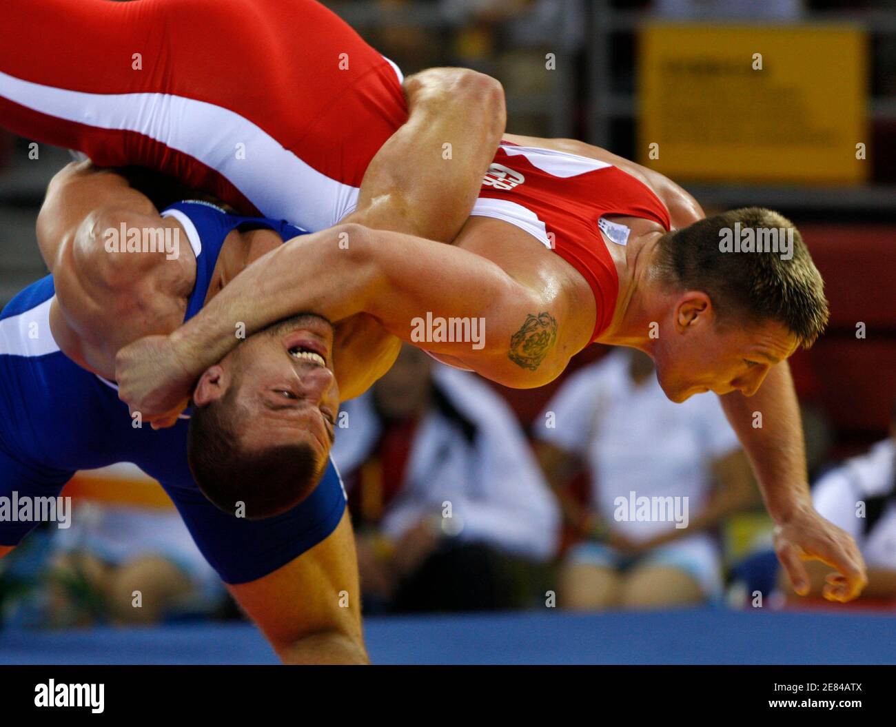 Mirko Englich of Germany (top) fights Elis Guri of Albania during their 96kg men's Greco-Roman wrestling quarter-final match at the Beijing 2008 Olympic Games August 14, 2008.     REUTERS/Oleg Popov (CHINA) Stock Photo