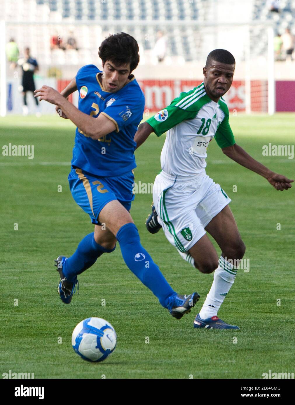 EDITORS' NOTE: Reuters and other foreign media are subject to Iranian restrictions on leaving the office to report, film or take pictures in Tehran.     Khosro Heydari (L) of Iran's Esteghlal fights for the ball with Faraj Ahmed Darvish of Saudi Arabia's Al Ahli during their AFC Champions League soccer match at Tehran's Azadi stadium April 14, 2010. REUTERS/Raheb Homavandi (IRAN - Tags: SPORT SOCCER) Stock Photo