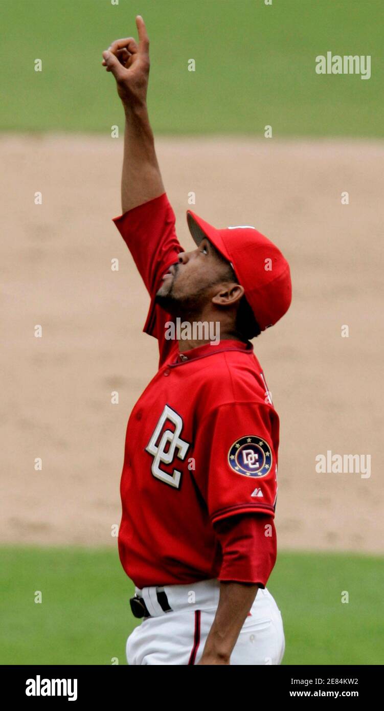 Washington Nationals starting pitcher Ramon Ortiz points skyward in the ninth inning during their baseball game against the St. Louis Cardinals in Washington, September 4, 2006. Ortiz pitched a no-hitter into the ninth inning and hit a home run in the eighth inning in the Nationals 4-1 victory.    REUTERS/Gary Cameron   (UNITED STATES) Stock Photo