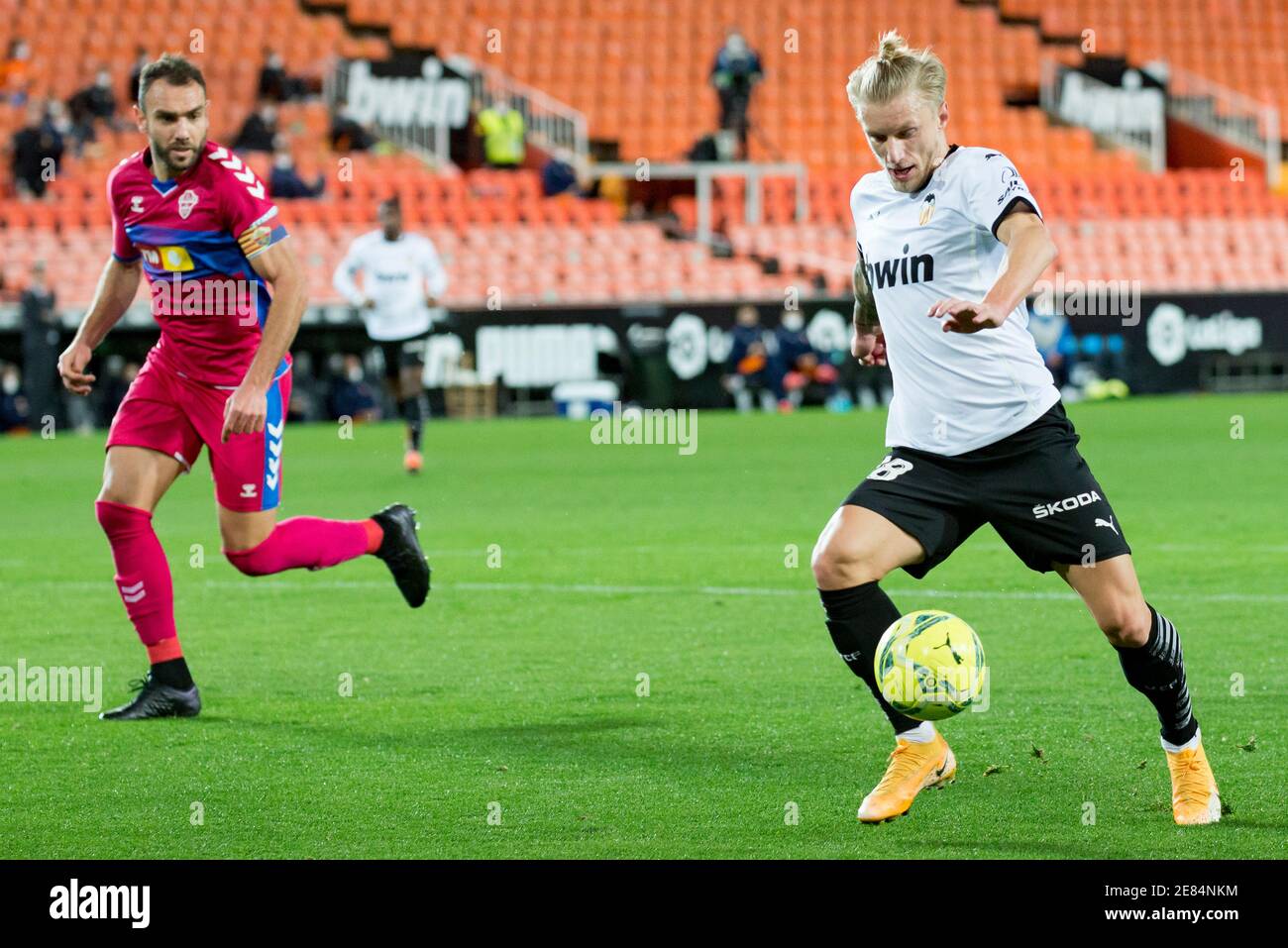Daniel Wass of Valencia and Gonzalo Verdu of Elche are seen in action during the Spanish La Liga football match between Valencia and Elche at Mestalla Stadium.(Final score; Valencia 1:0 Elche) Stock Photo