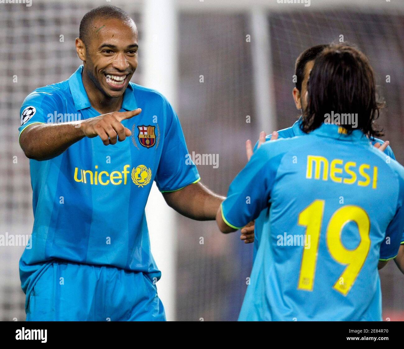 Lionel Messi and Thierry Henry (L) of Barcelona celebrate their team's  second goal during the Champions League Group E match against VfB Stuttgart  in Stuttgart October 2, 2007. REUTERS/Kai Pfaffenbach (GERMANY Stock