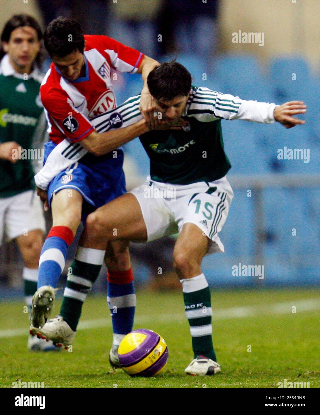 Atletico Madrid's Luis Garcia (L) and Panathinaikos' Panagiotis Fissas  fight for the ball during their UEFA Cup Group B soccer match at Madrid's  Vicente Calderon stadium December 20, 2007. REUTERS/Andrea Comas (SPAIN